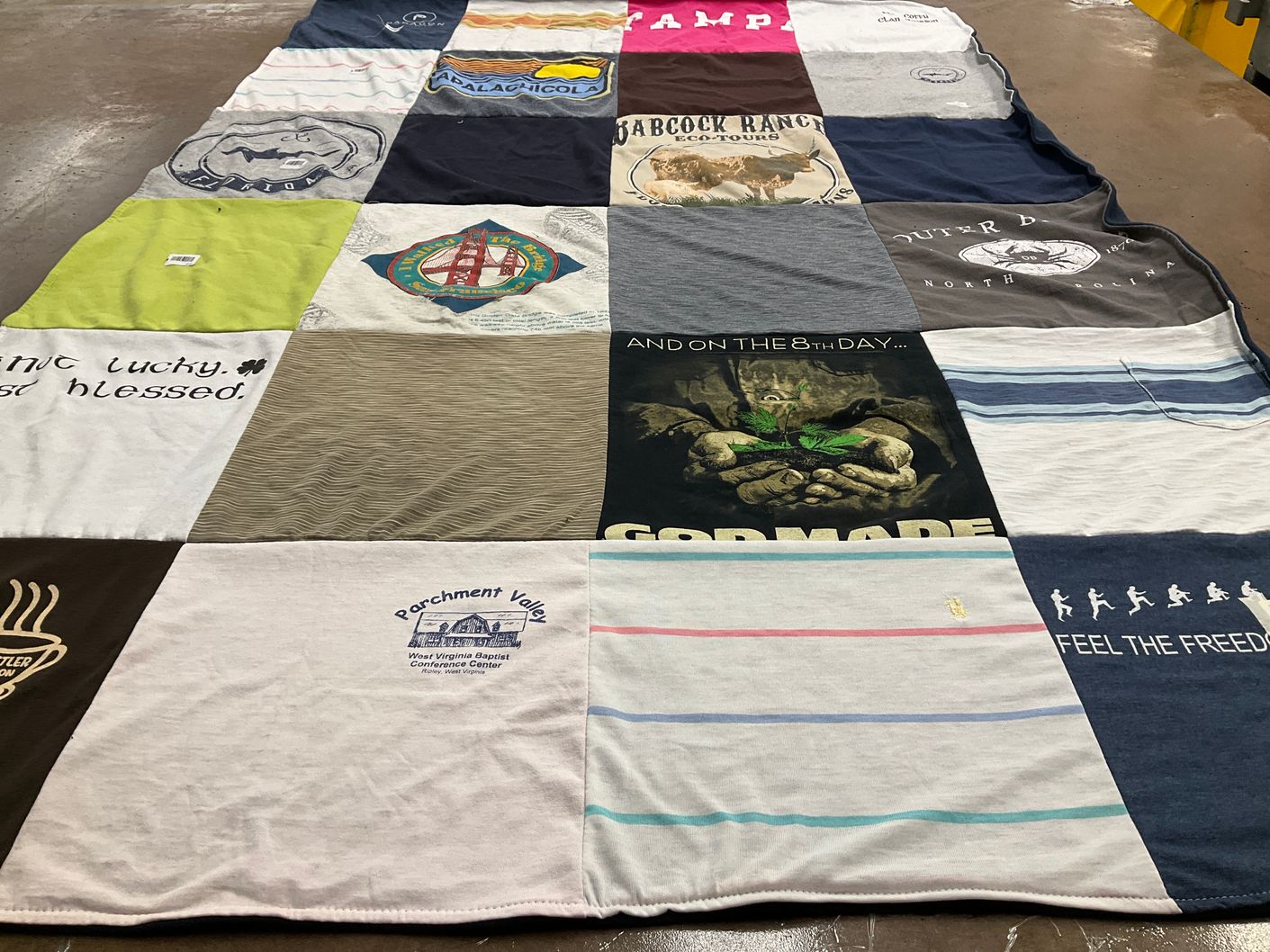 T-shirt quilt with eco-tours, camping themes by Jayne from OH