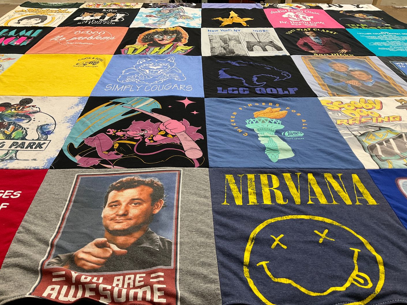 T-shirt quilt with music, sports themes by Lora from KY
