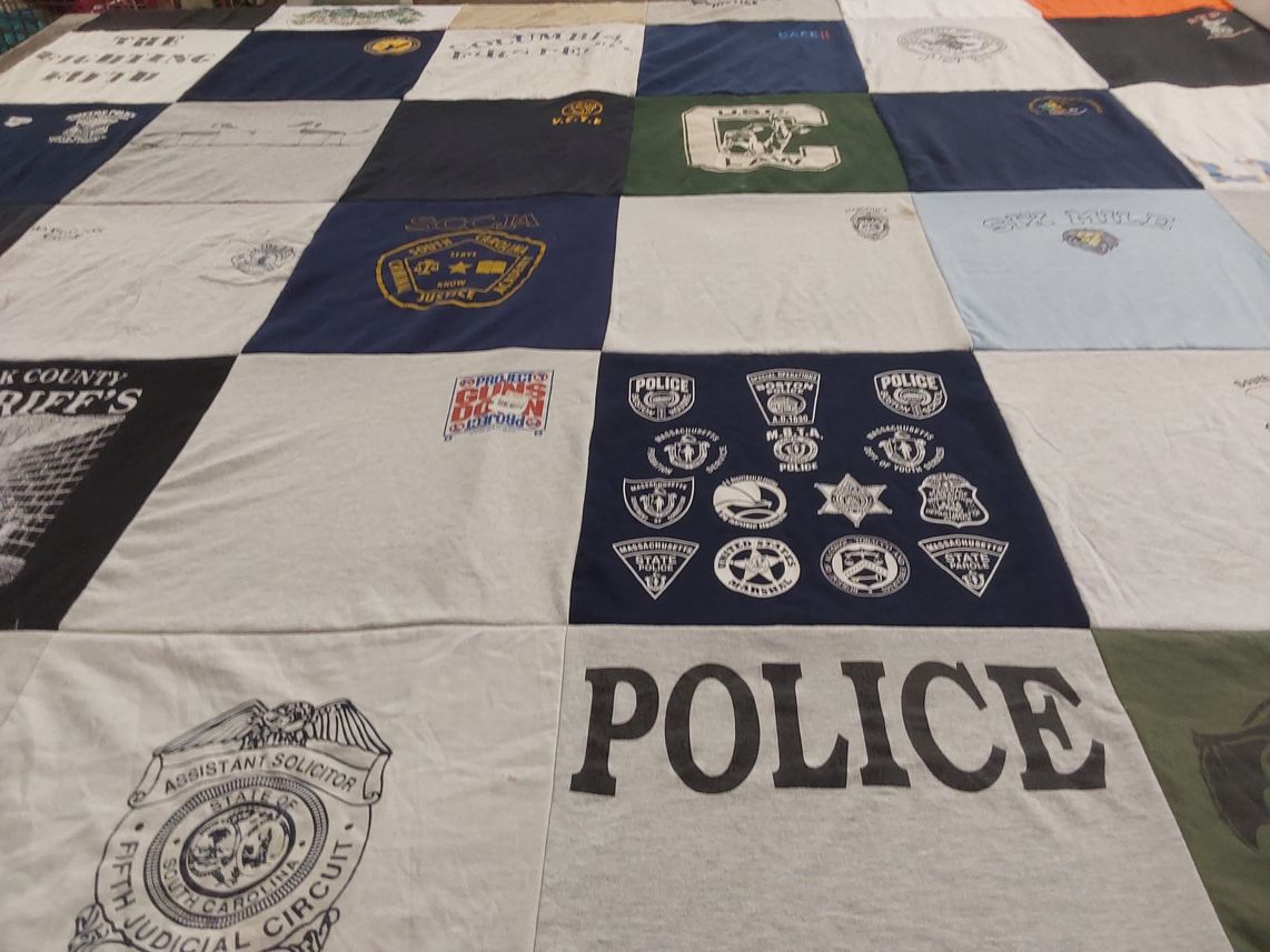 T-shirt quilt with law enforcement, community service themes by Stacey from SC