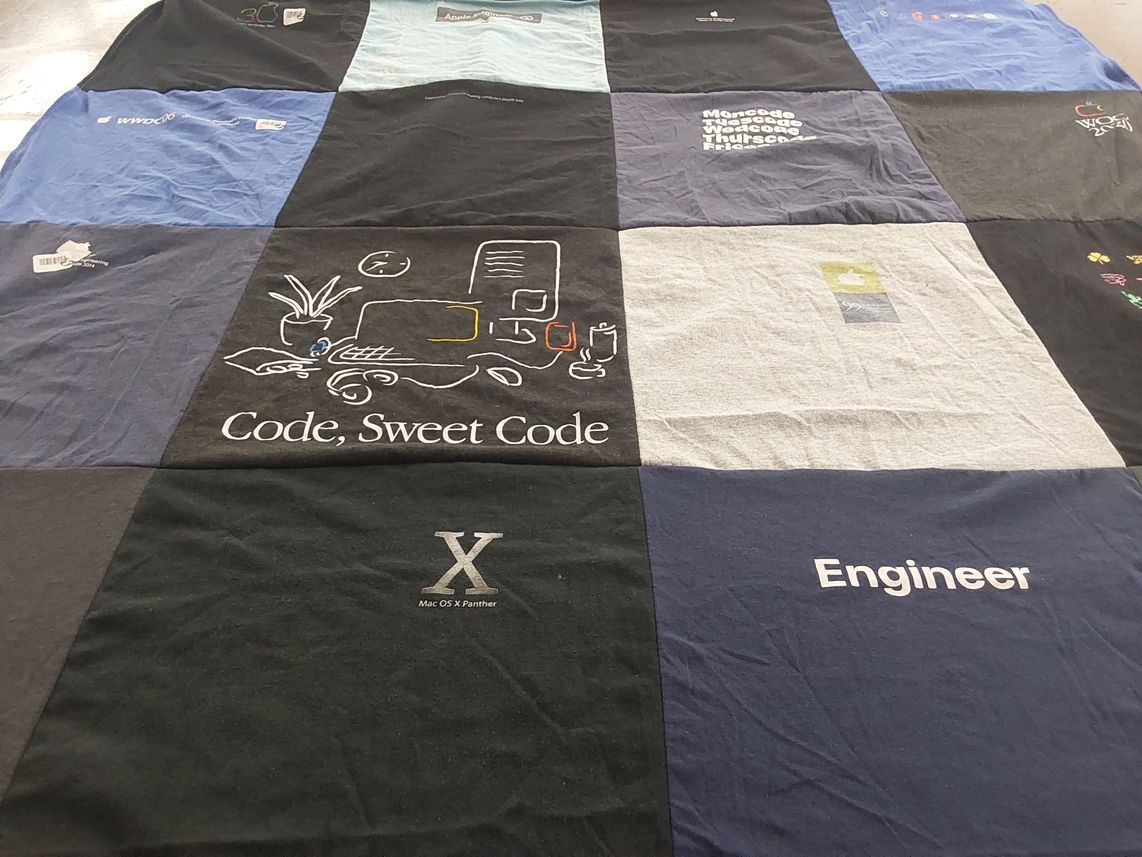 T-shirt quilt with programming, technology themes by Teresa from CA