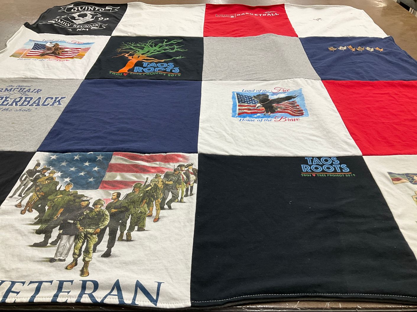 T-shirt quilt with veterans, community projects themes by Bonavita from NM