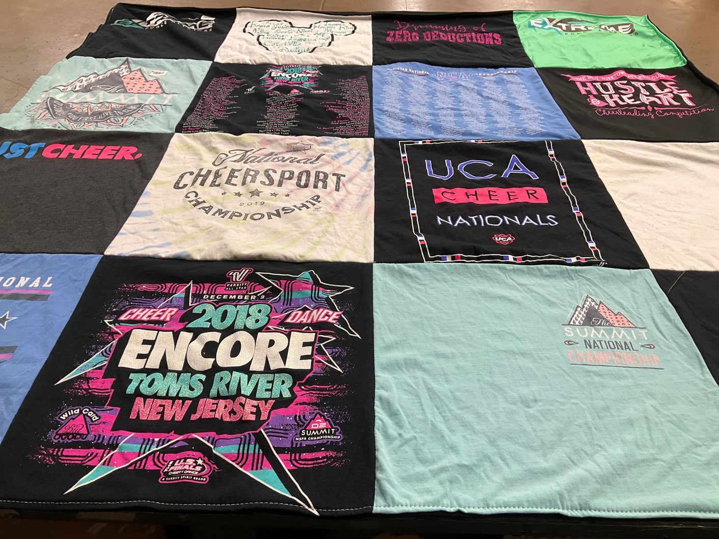 T-shirt quilt with cheerleading, dance competitions themes by Nancy from NY