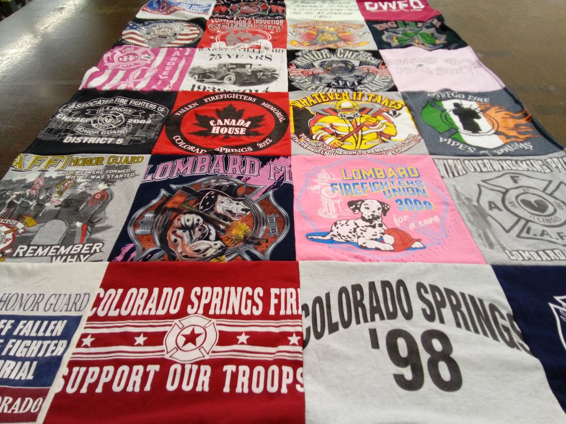 T-shirt quilt with firefighting, community service themes by Valerie from IL