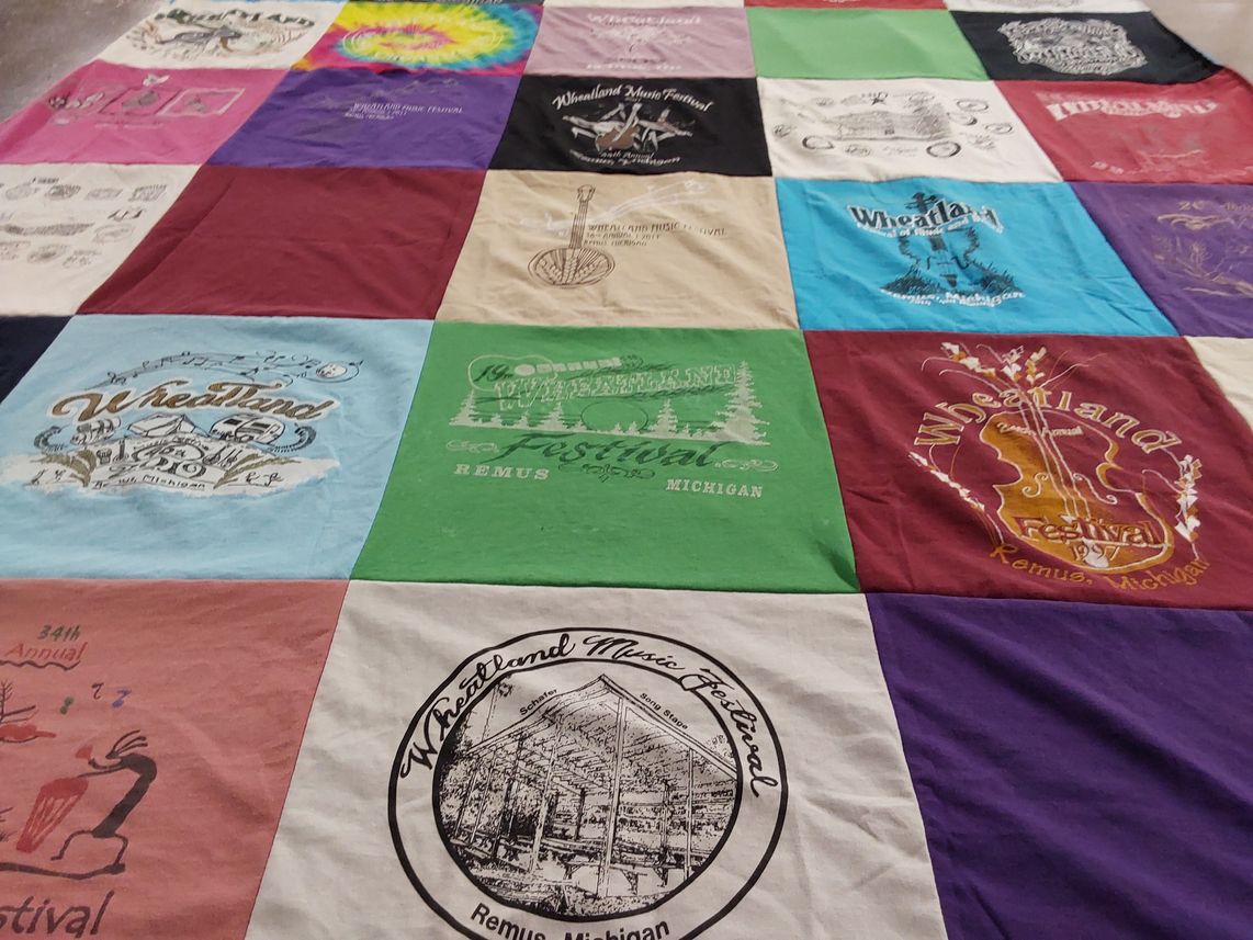 T-shirt quilt with music festivals themes by Angie from MI