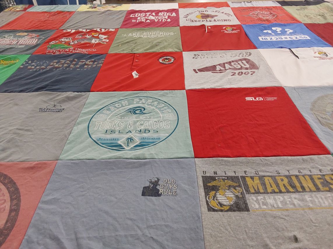 T-shirt quilt with travel, cheerleading themes by Beth from GA