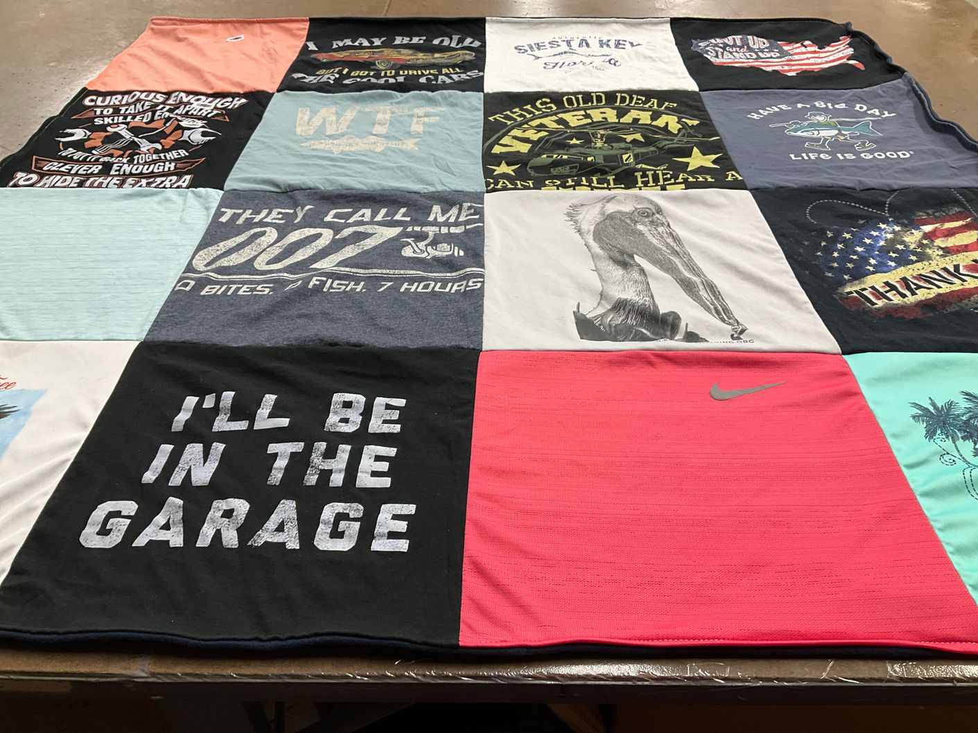 T-shirt quilt with fishing, veterans themes by Corey from PA