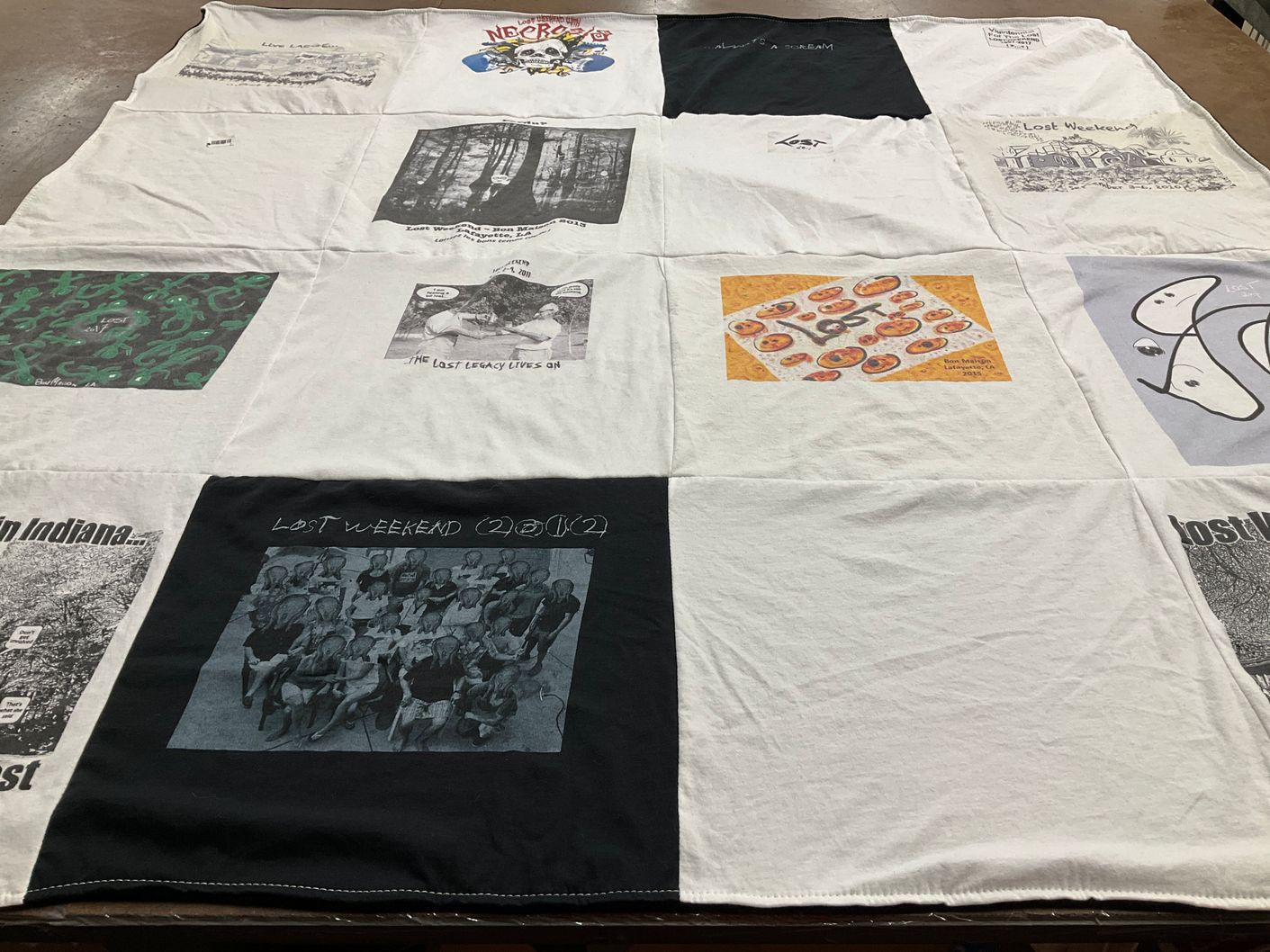 T-shirt quilt with art, music themes by Denneen from MI