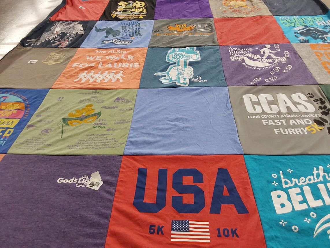 T-shirt quilt with running, community events themes by Laura from GA