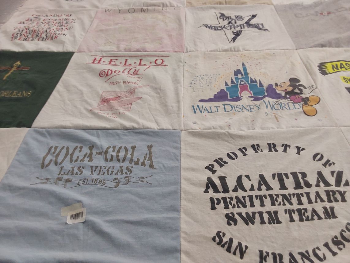 T-shirt quilt with theater, disney themes by Karen from WI