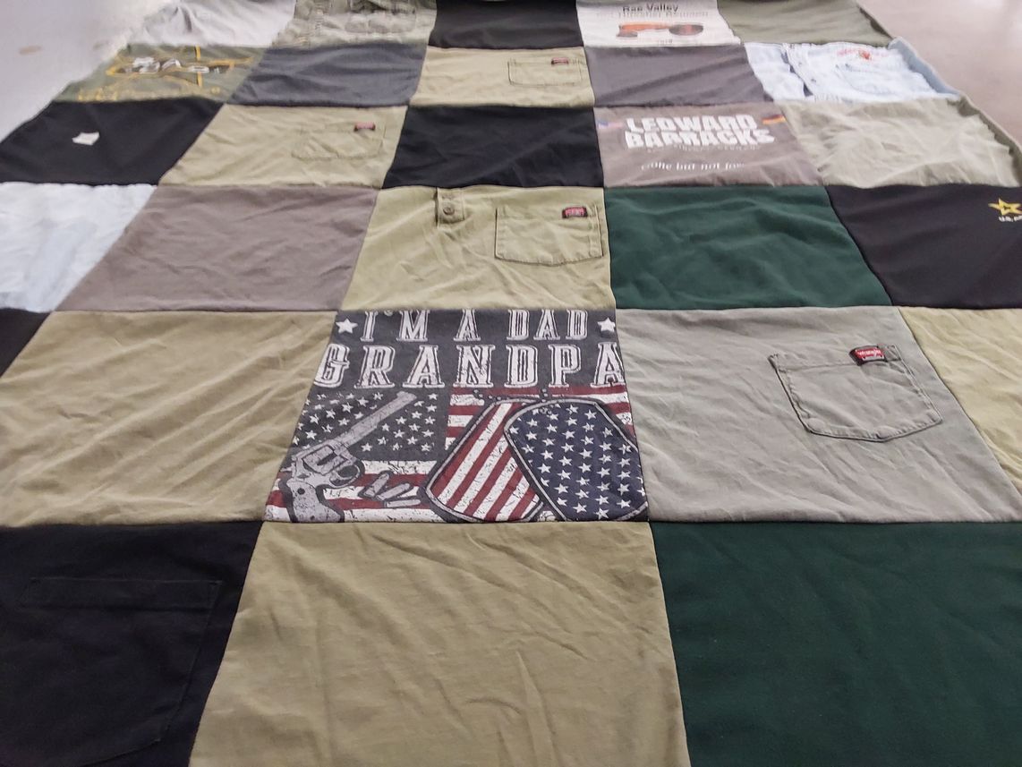 T-shirt quilt with family themes by Victoria from NE