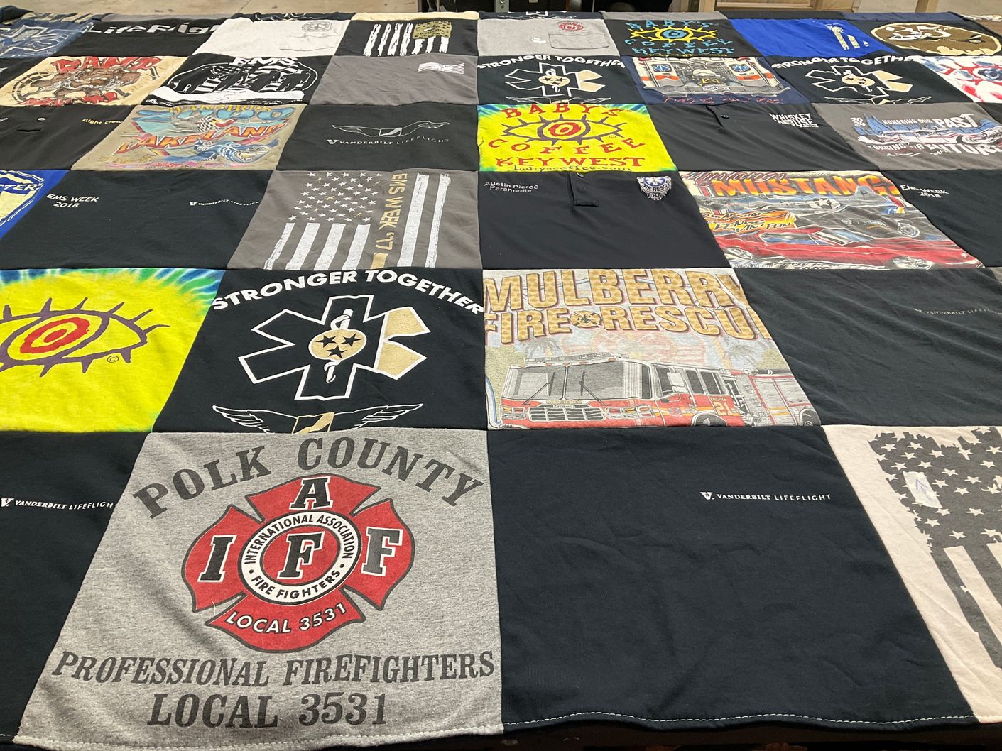 T-shirt quilt with firefighting, community service themes by Austin from TN