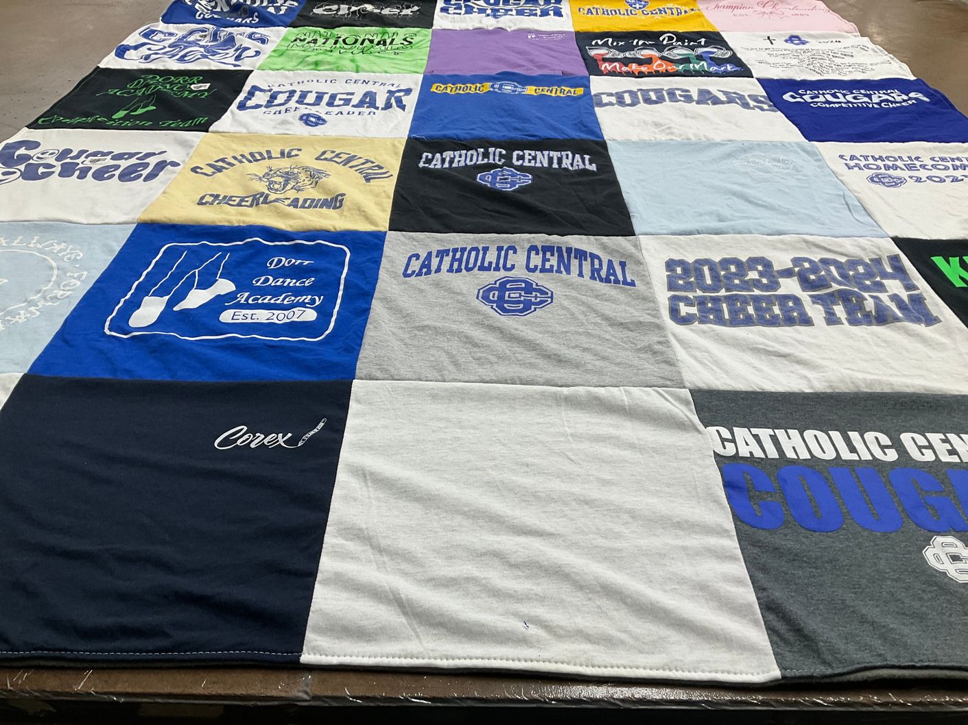 T-shirt quilt featuring catholic central cougars by Kristen from MI
