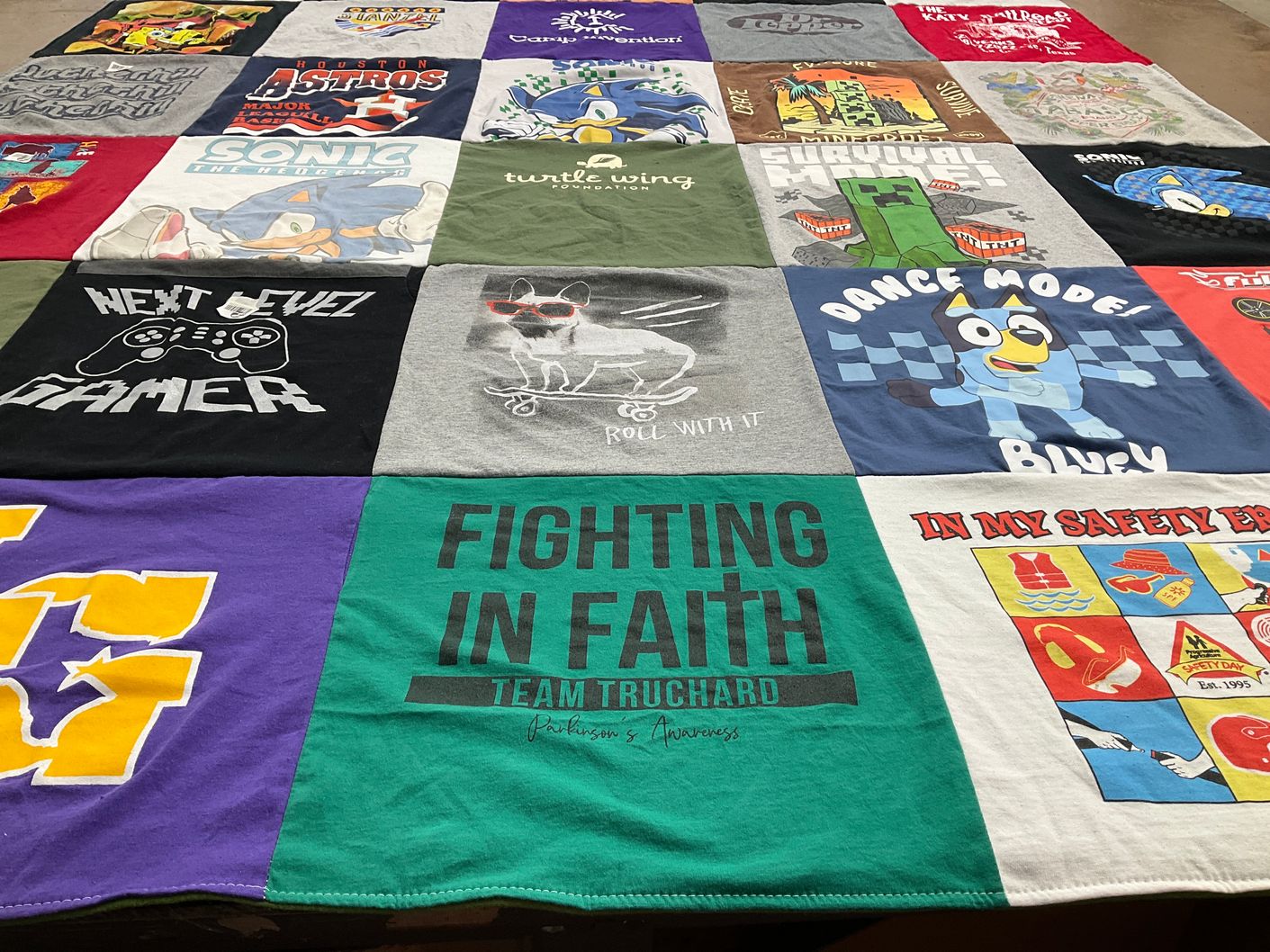 T-shirt quilt with gaming, sports themes by James from TX