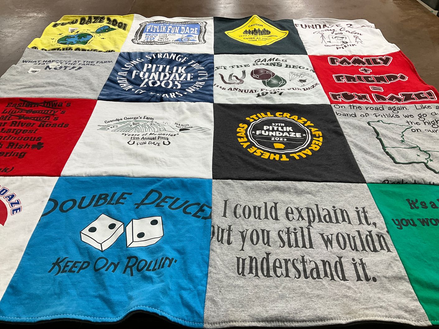 T-shirt quilt with fun events, community gathering themes by SUSAN from IA
