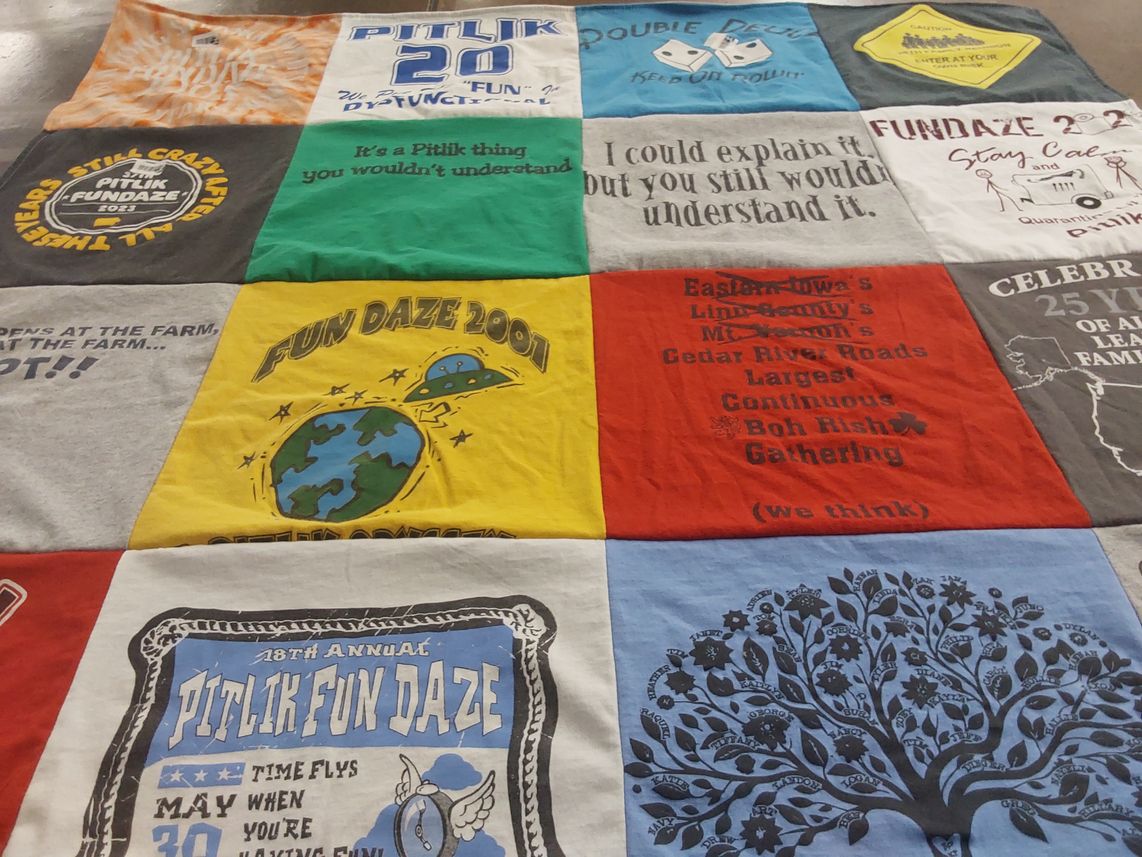 T-shirt quilt with community events, festivals themes by SUSAN from IA