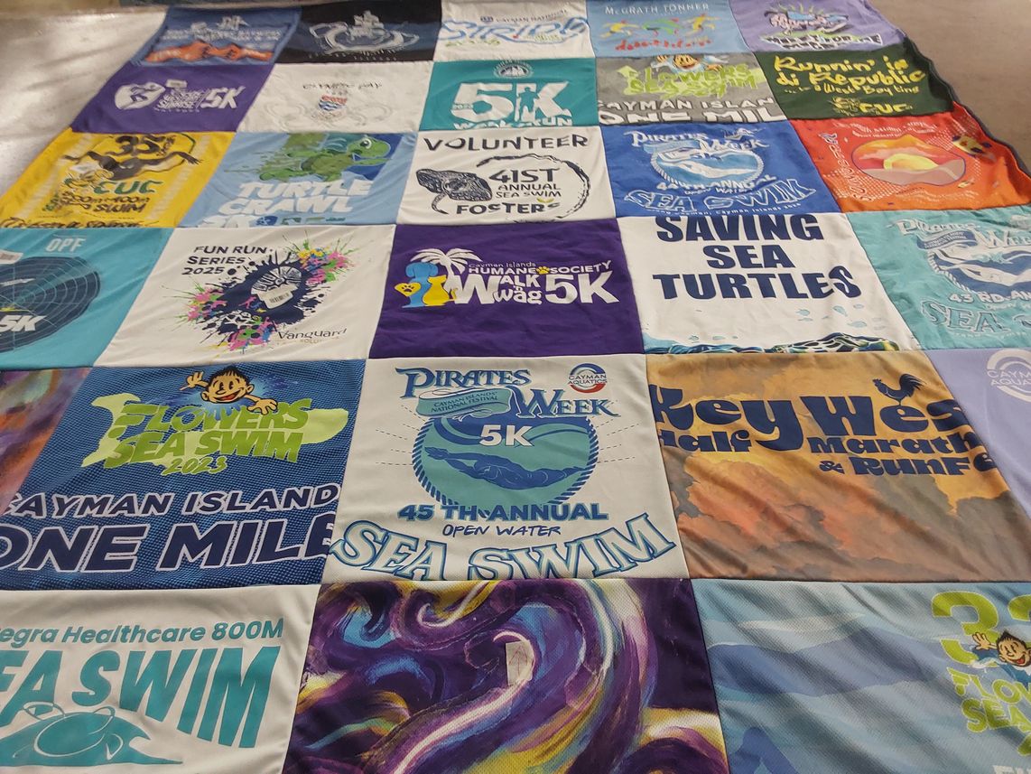 T-shirt quilt with running, swimming themes by Christopher from FL