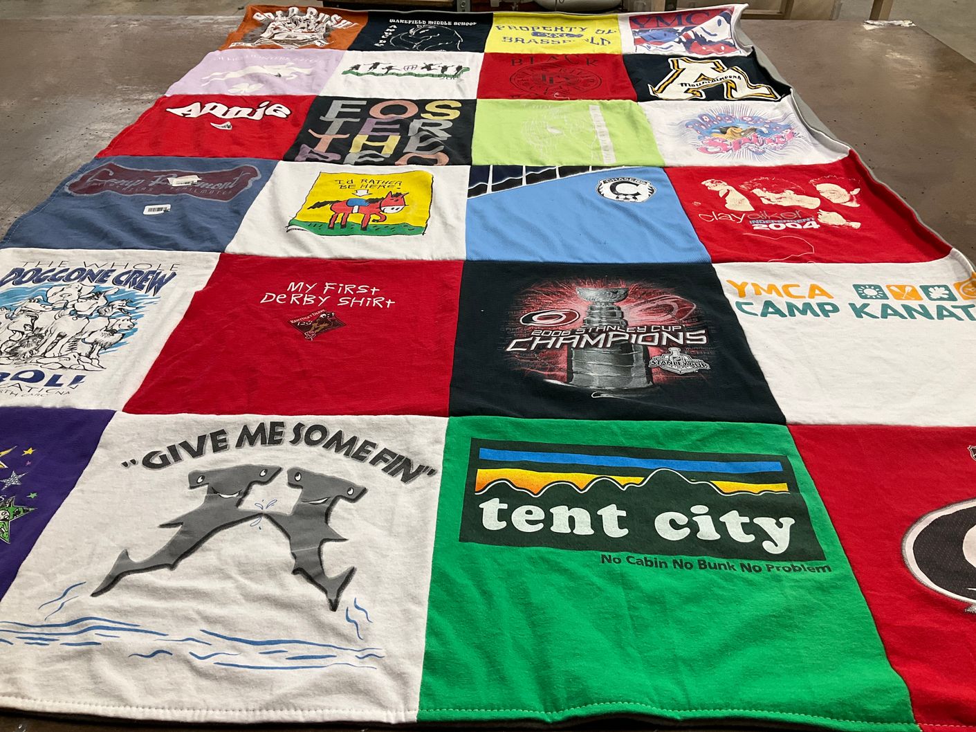T-shirt quilt with camping, sports themes by Aileen from NC
