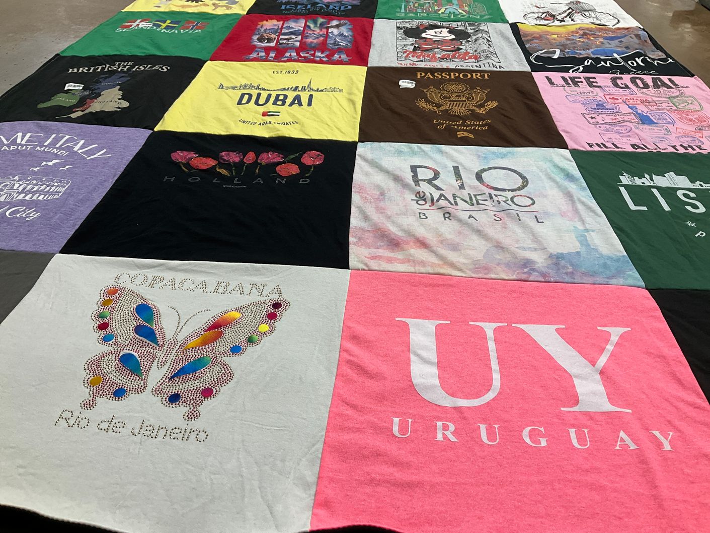 T-shirt quilt with travel, culture themes by Marjorie  from CA