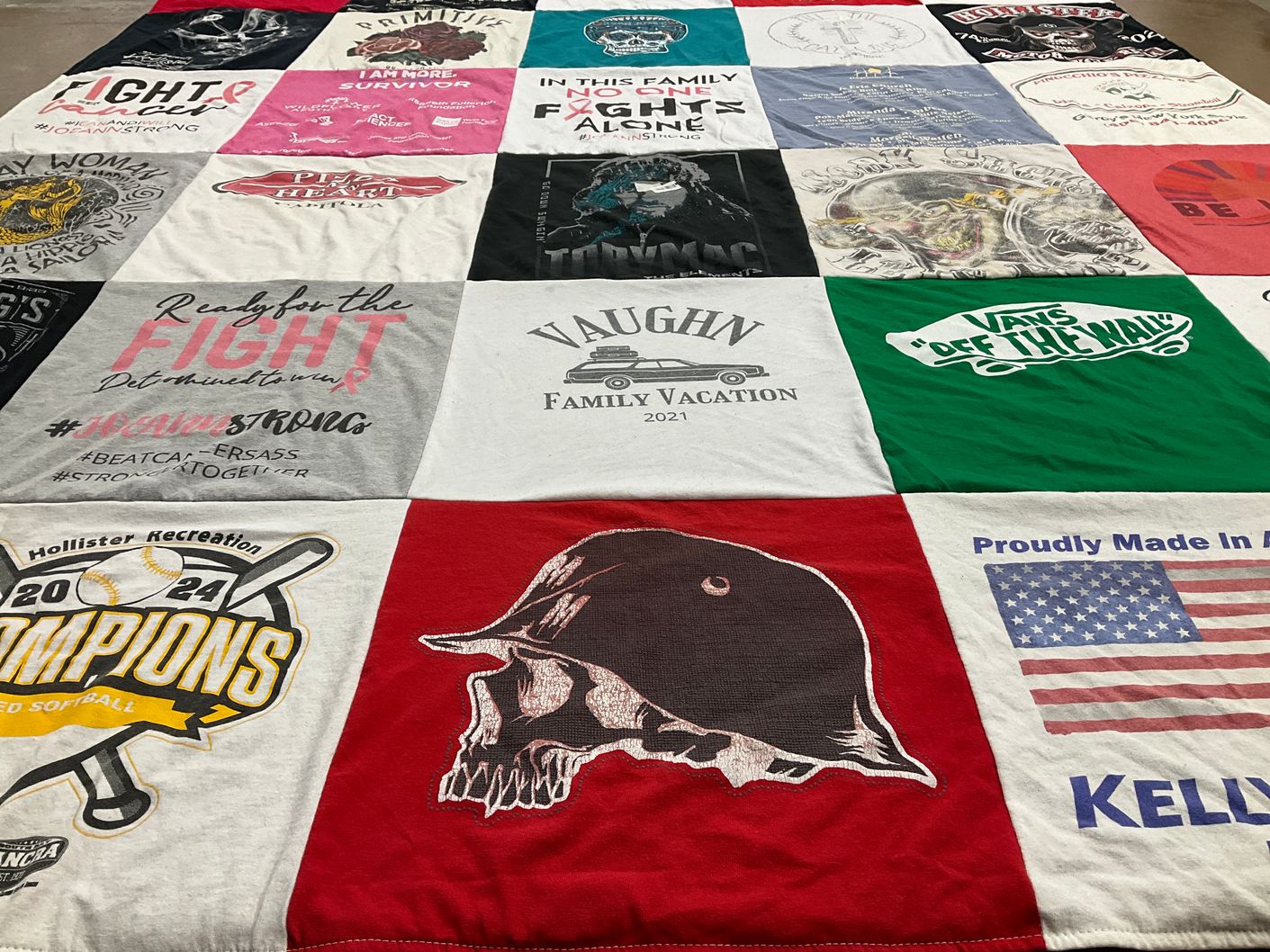 T-shirt quilt with breast cancer awareness, family vacations themes by Joeann from CA