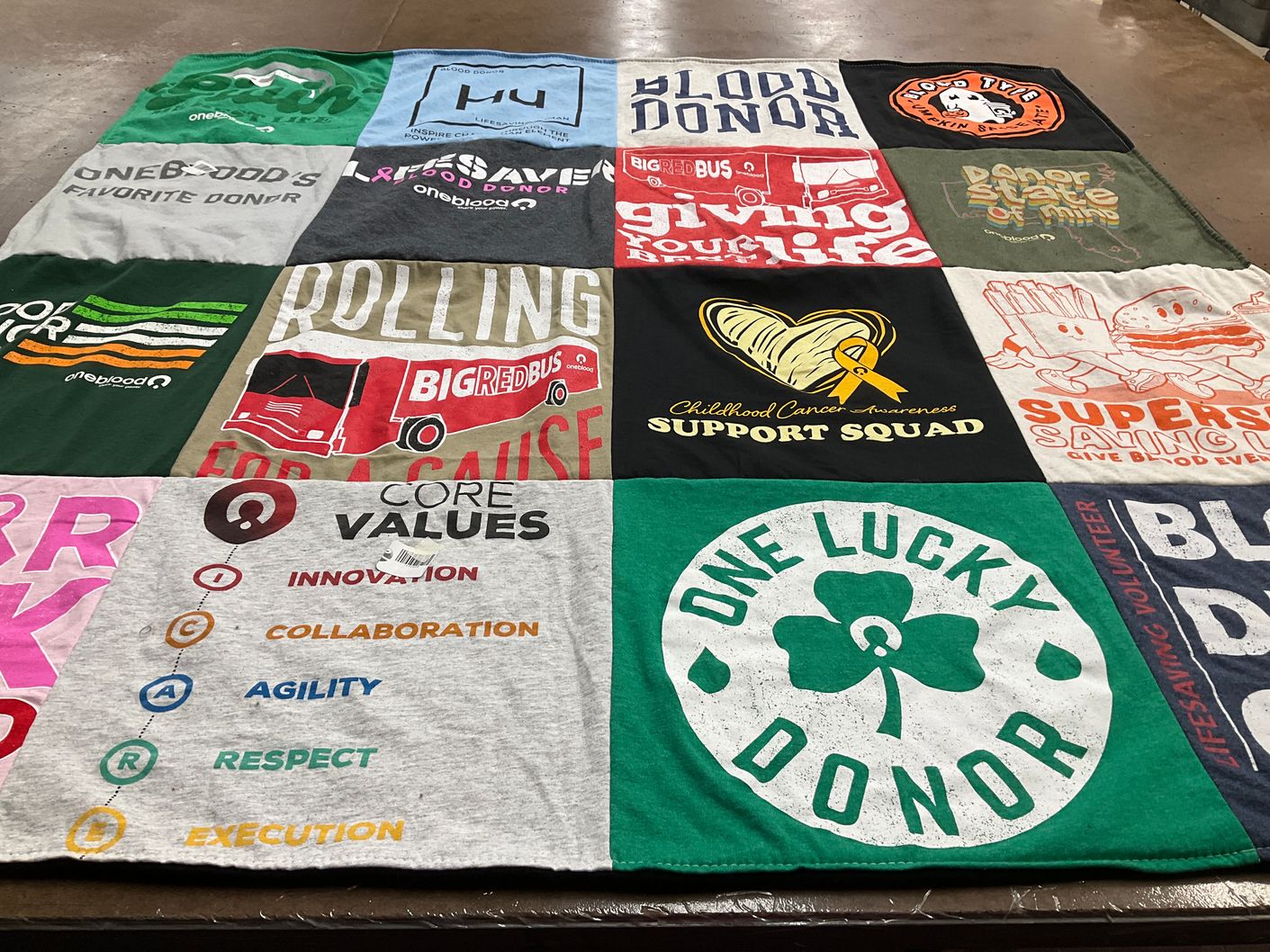T-shirt quilt with donating, volunteering themes by Raine from FL