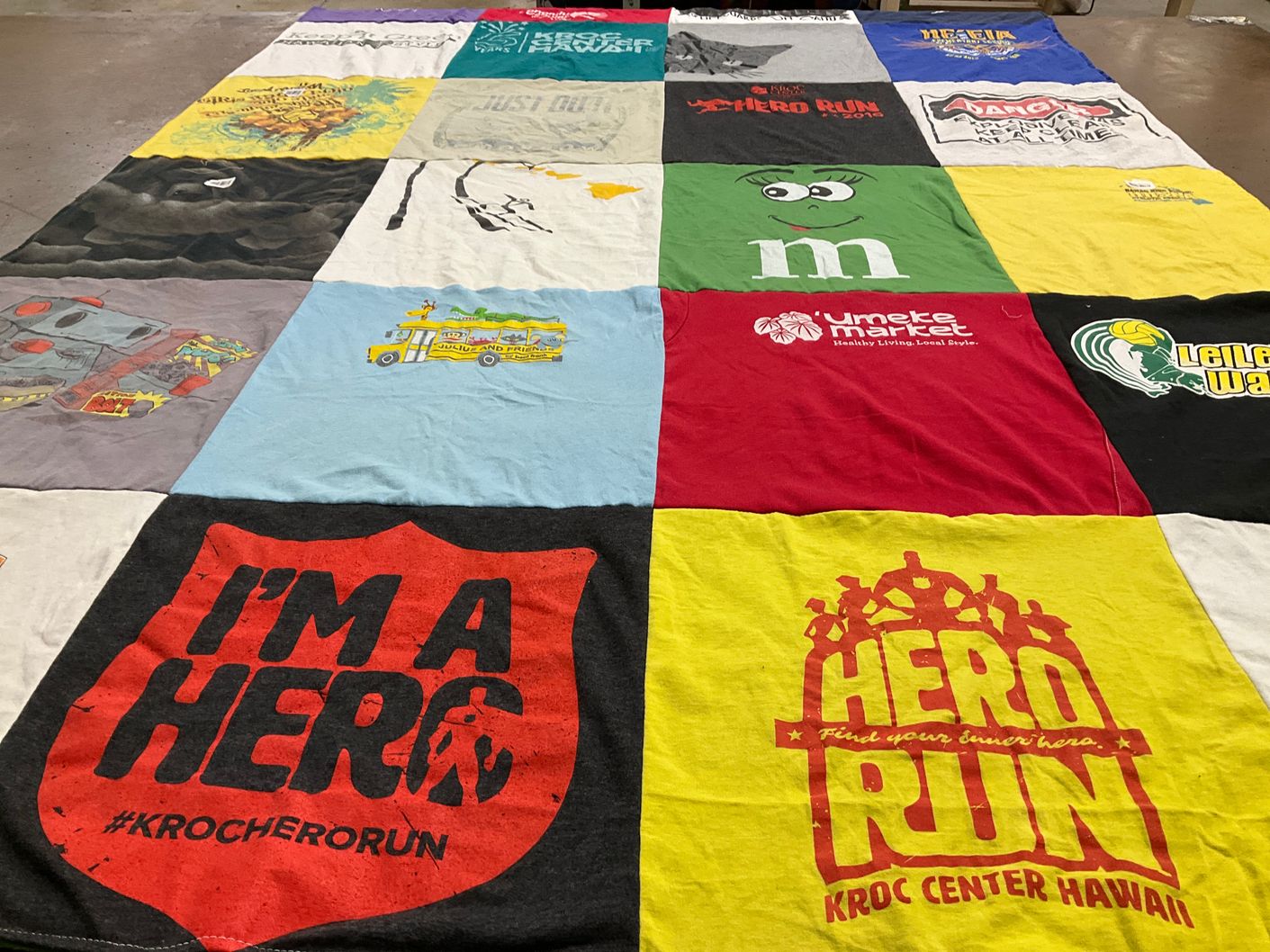 T-shirt quilt with community events, running themes by Imelda from HI