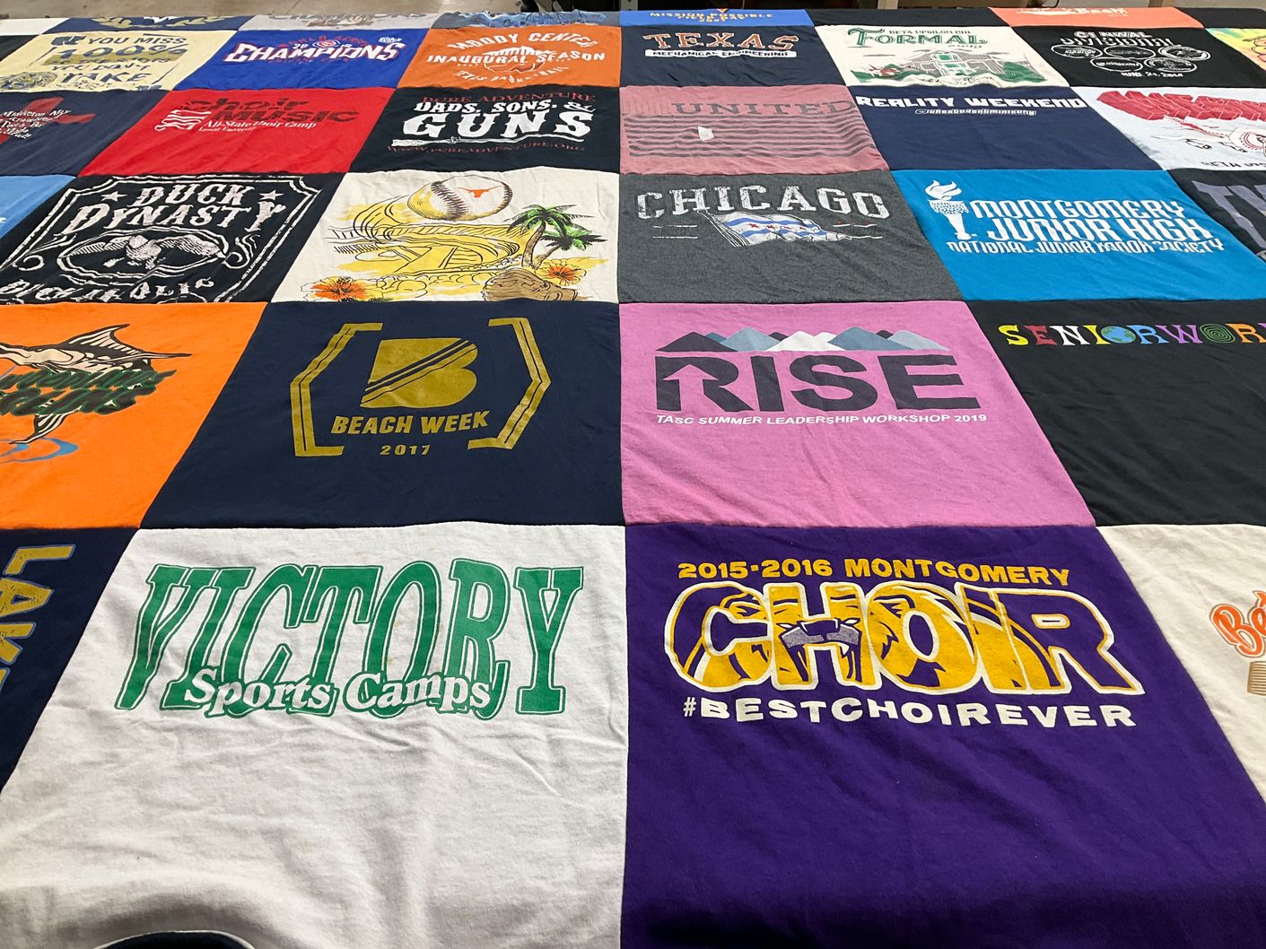 T-shirt quilt with sports, music themes by Cynthia from TX