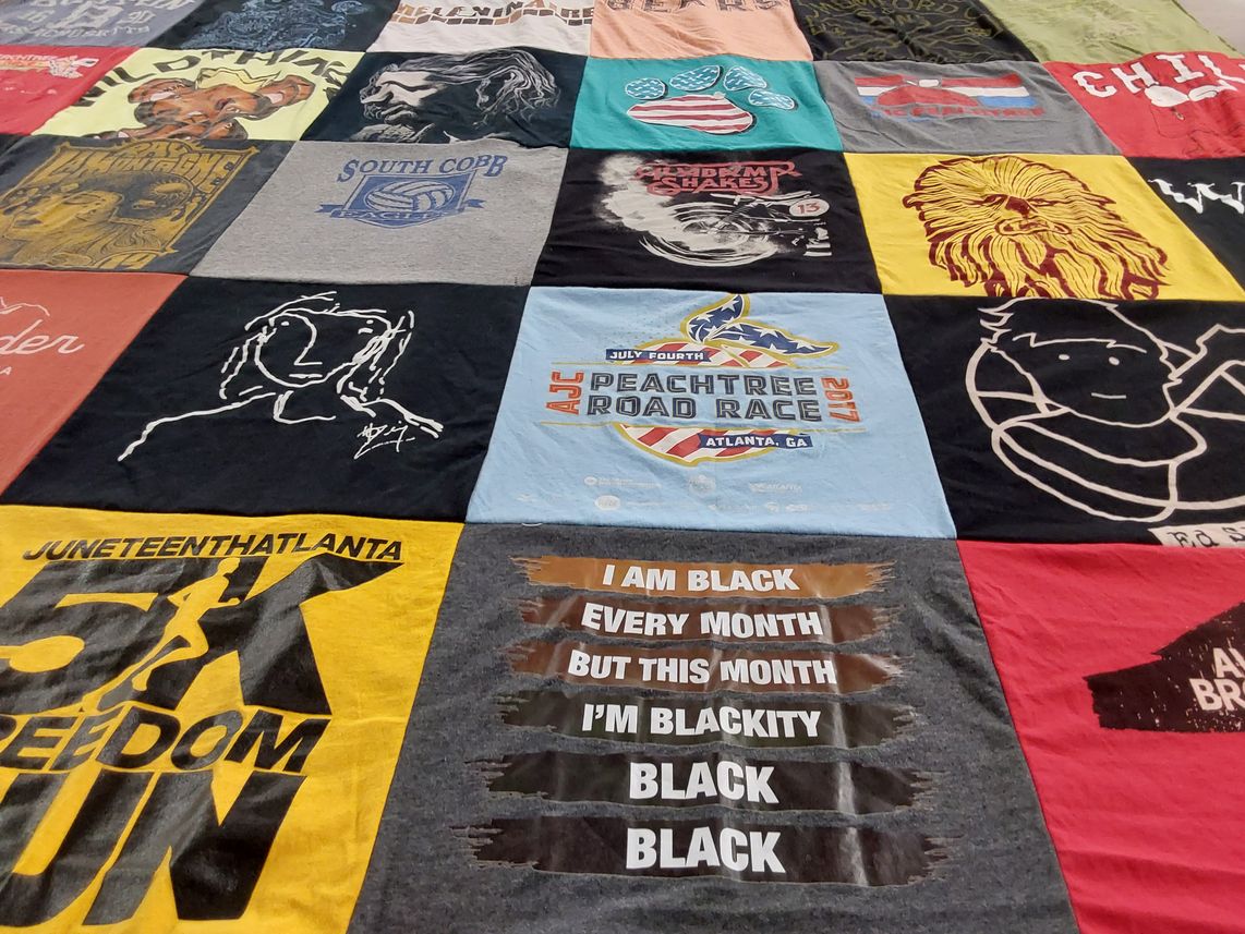 T-shirt quilt with community,  activism themes by Mimi from GA