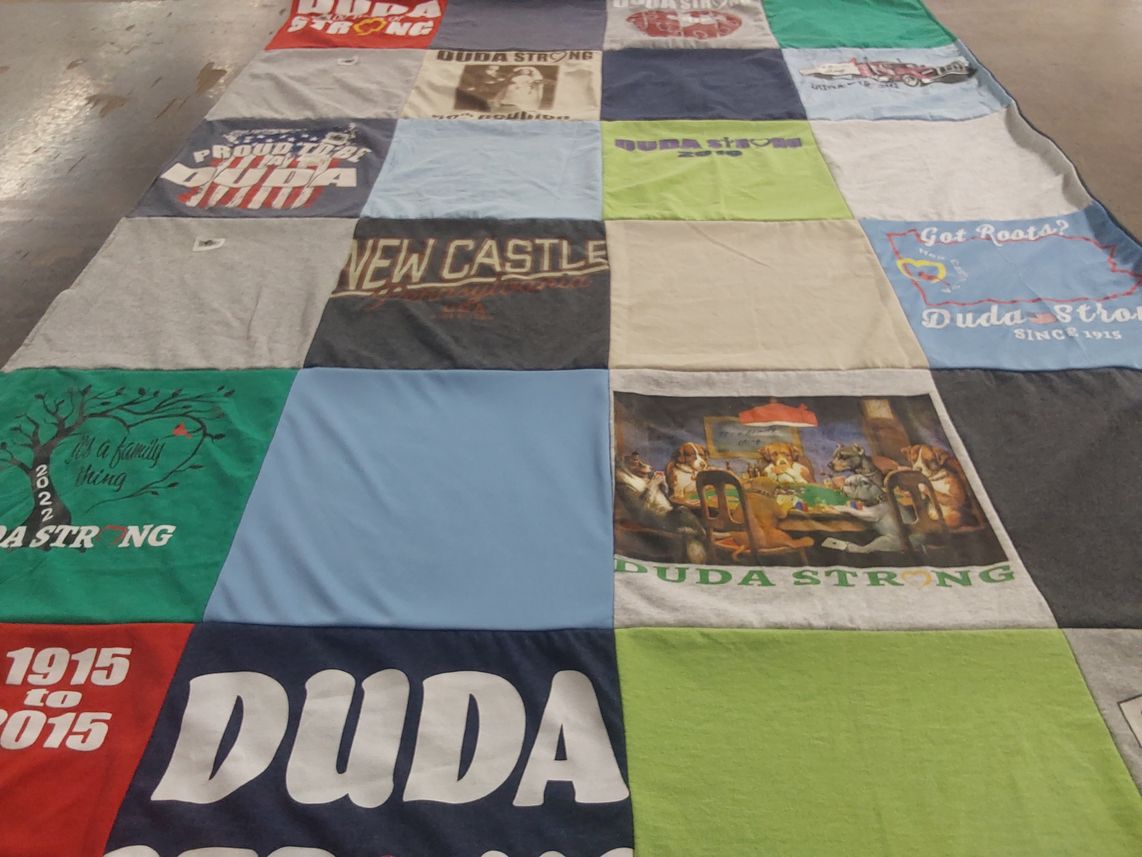 T-shirt quilt with family, community themes by Linda from FL