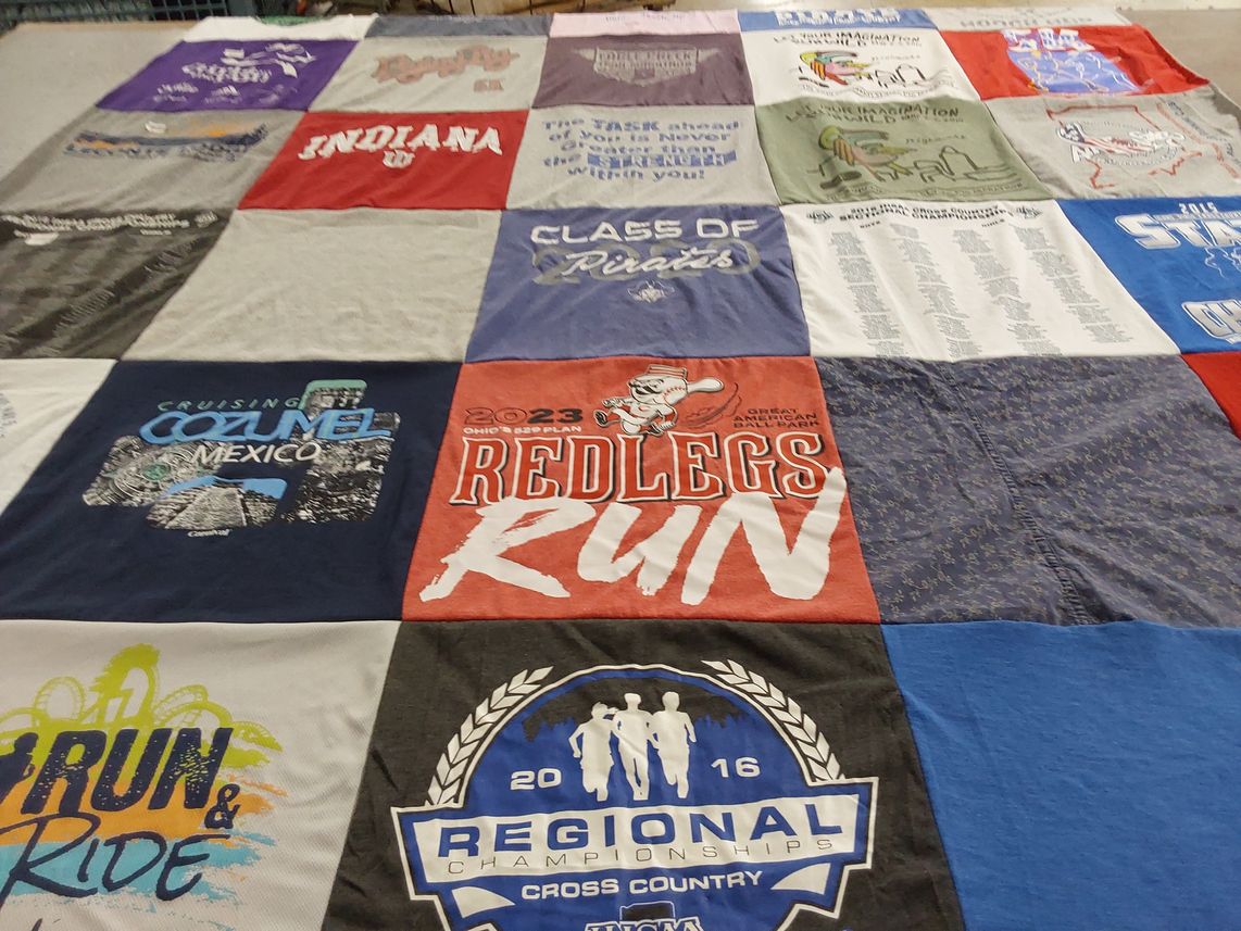 T-shirt quilt with running, traveling themes by Jessica from IN