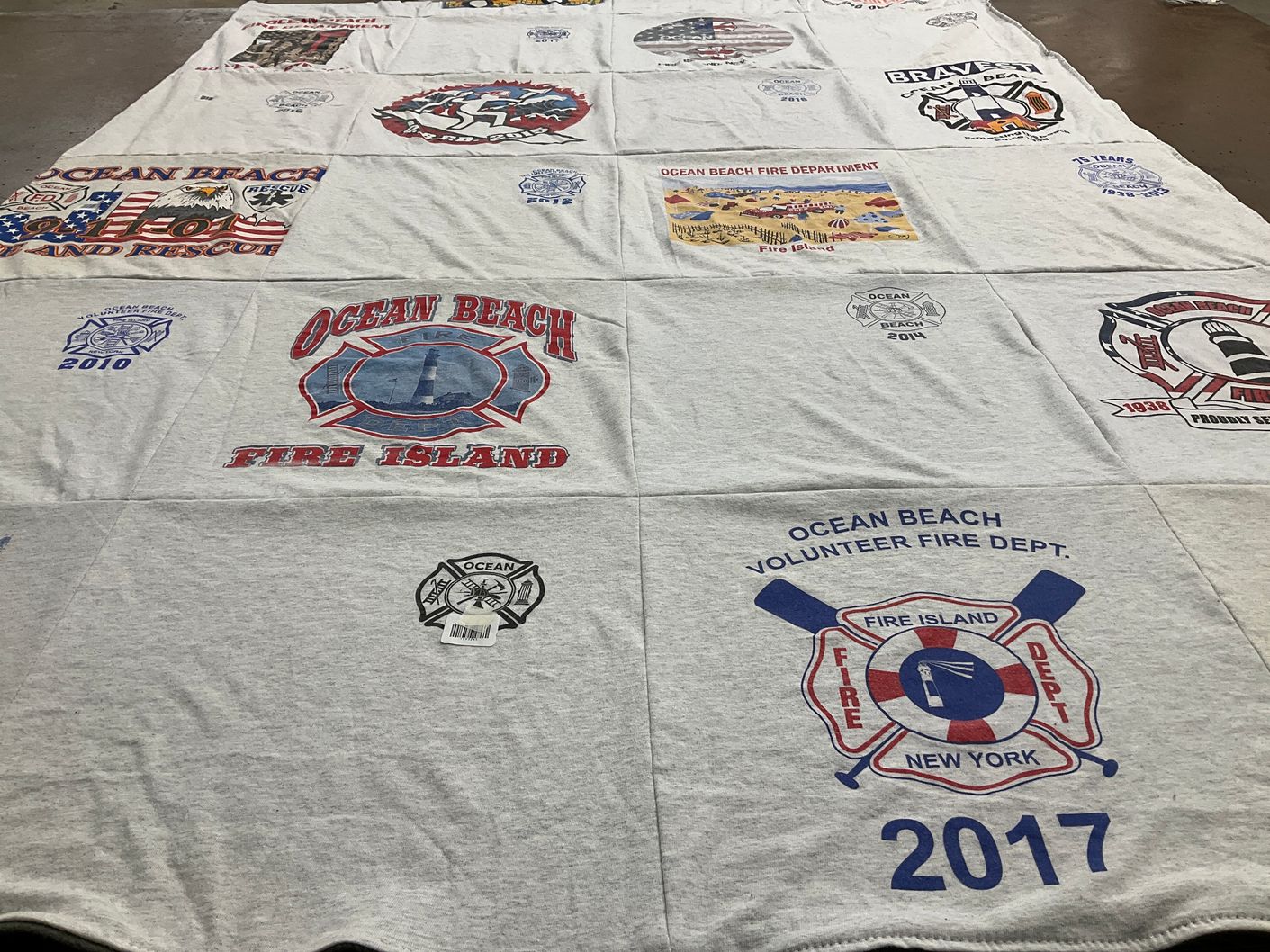 T-shirt quilt with firefighting, community service themes by Susannah from NY