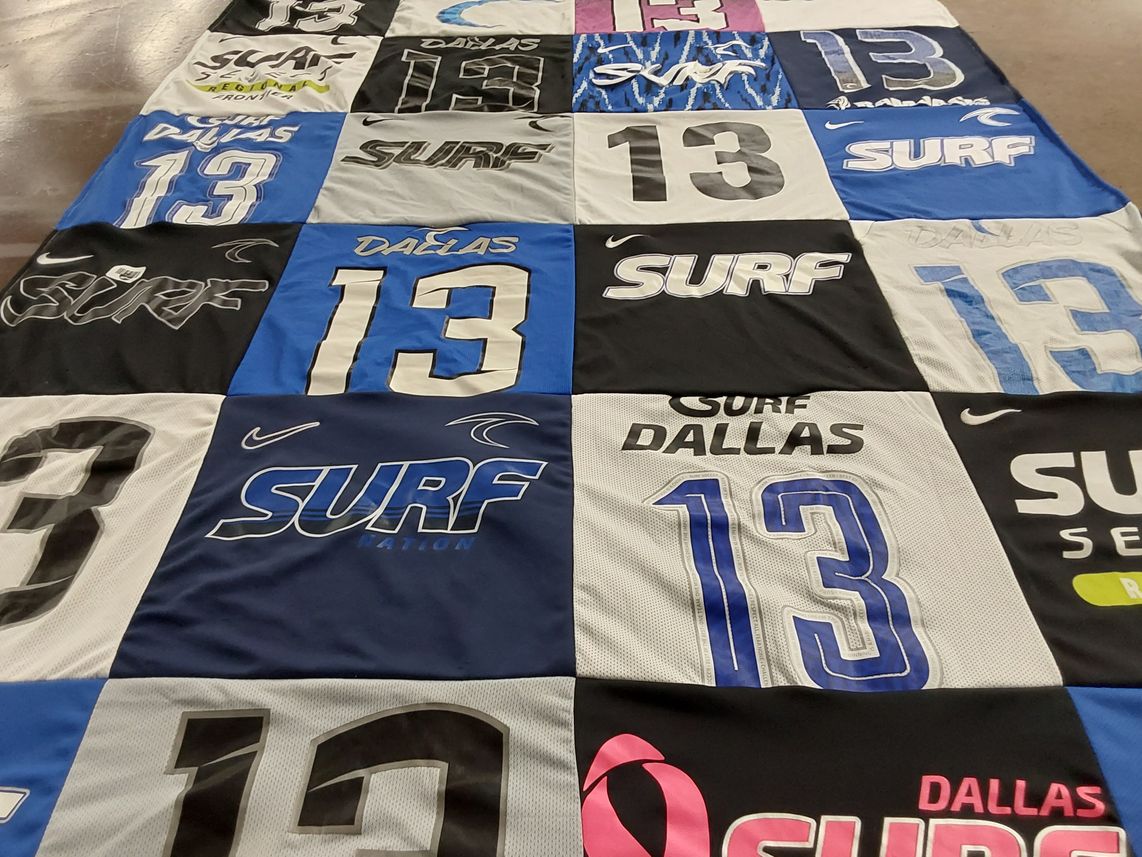 T-shirt quilt with swimming, athletics themes by Kirsten from TX