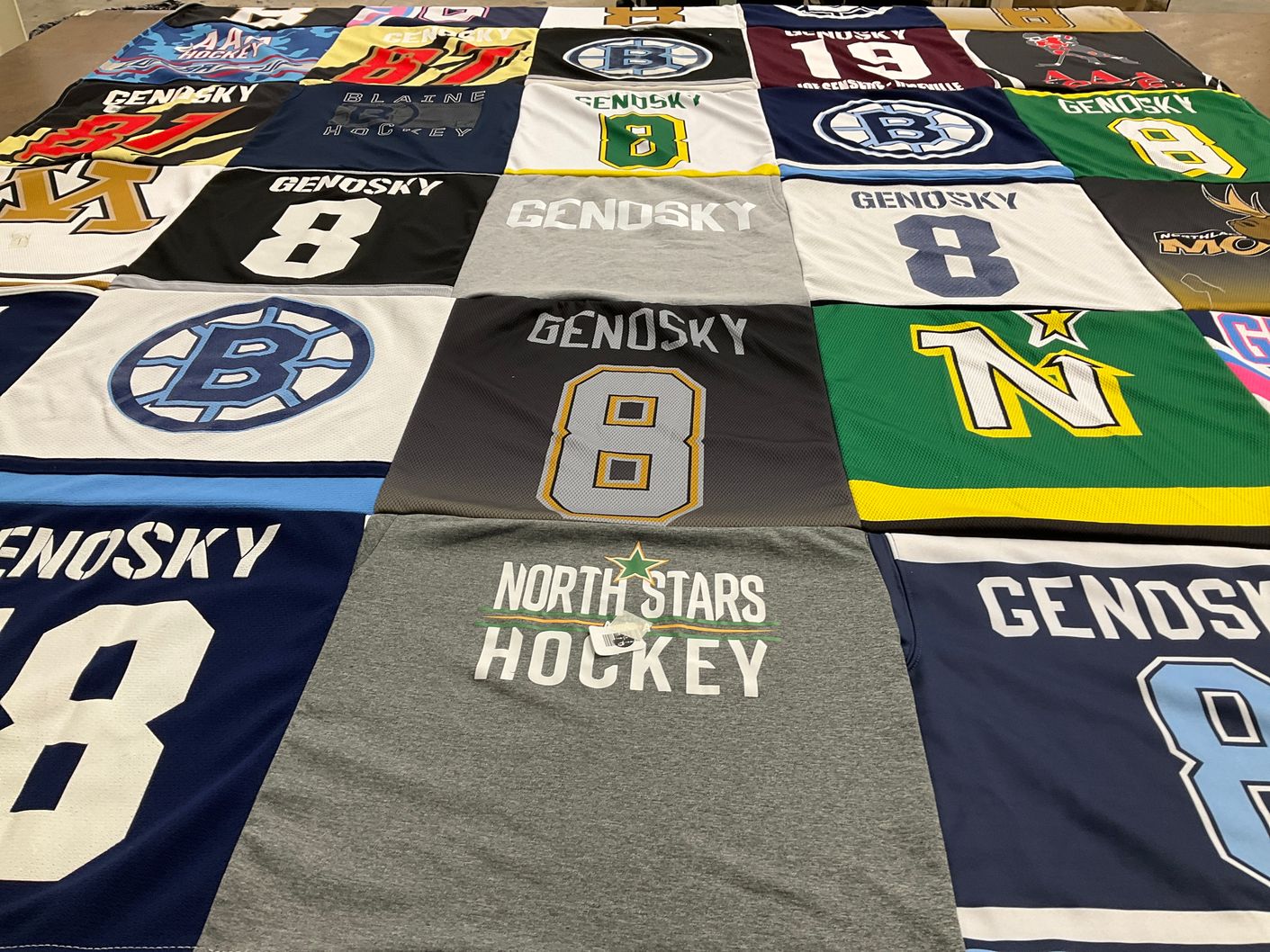 T-shirt quilt featuring north stars hockey by Amanda from MN