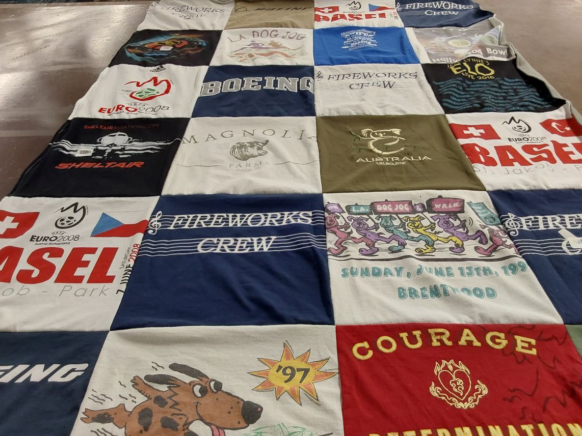 T-shirt quilt with sports, events themes by Carolyn from CA