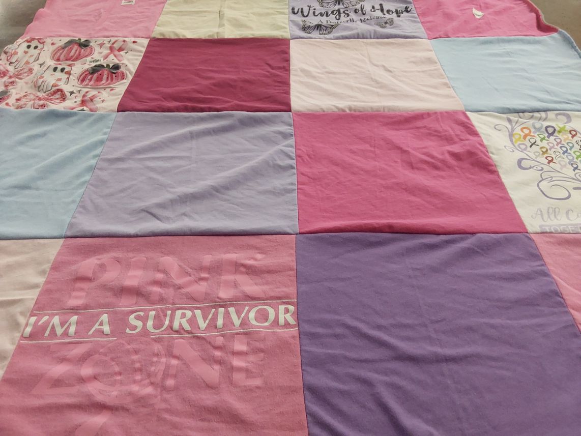 T-shirt quilt with breast cancer awareness, community support themes by Diane from PA