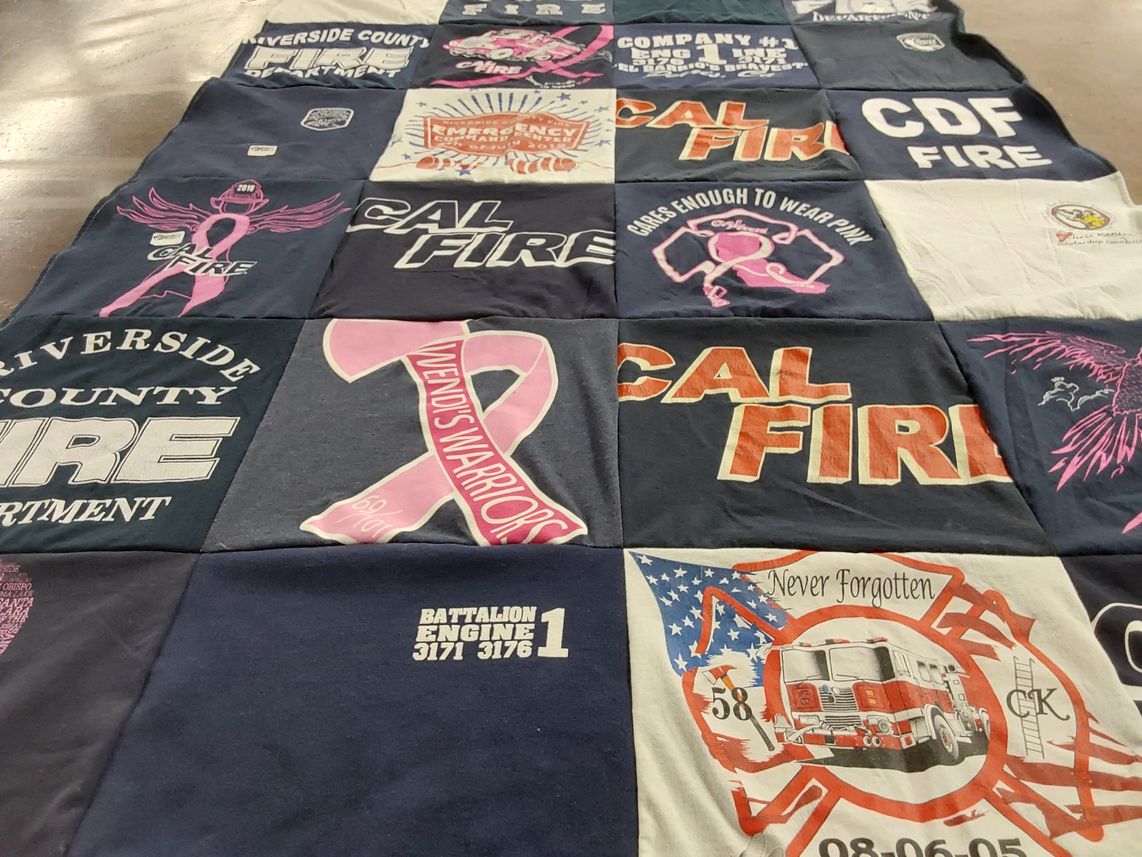 T-shirt quilt with firefighting, community service themes by Michelle from CA