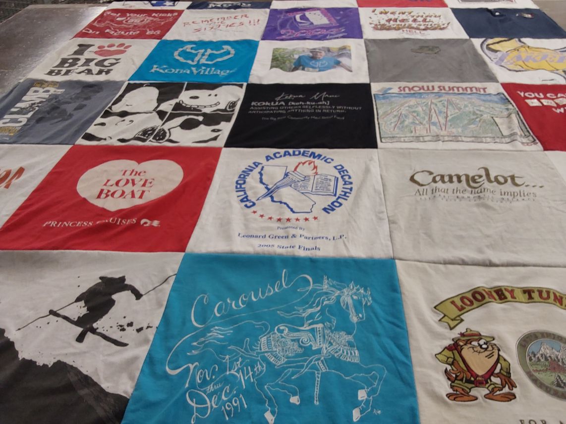 T-shirt quilt with travel, animation themes by Marlene from CA