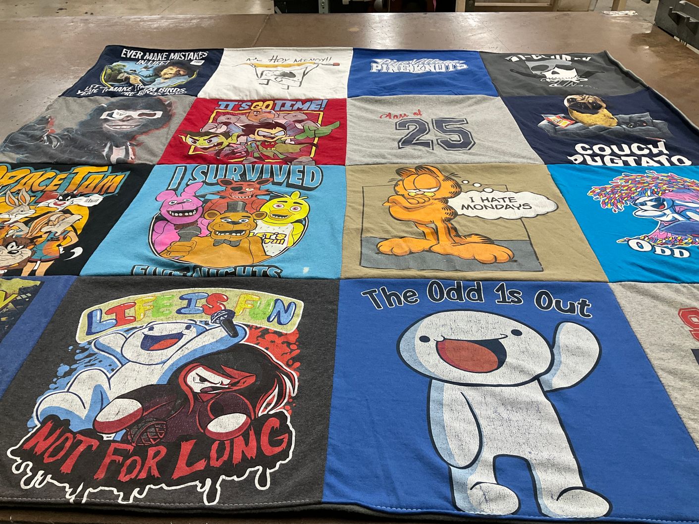 T-shirt quilt with cartoons, gaming themes by Teresa from IN
