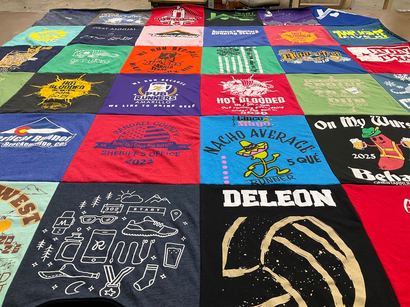 T-shirt quilt with running, beer themes by Tanya from TX
