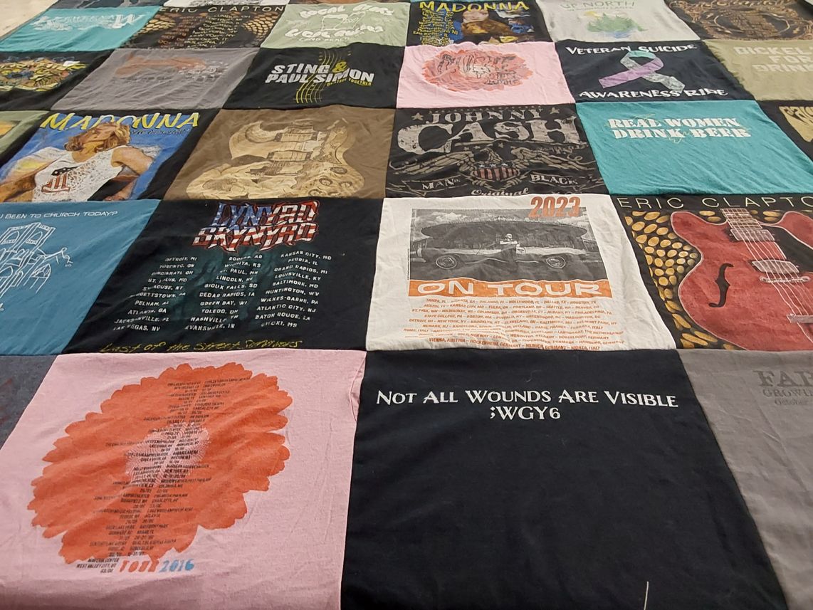 T-shirt quilt with music, awareness themes by Mary from WI