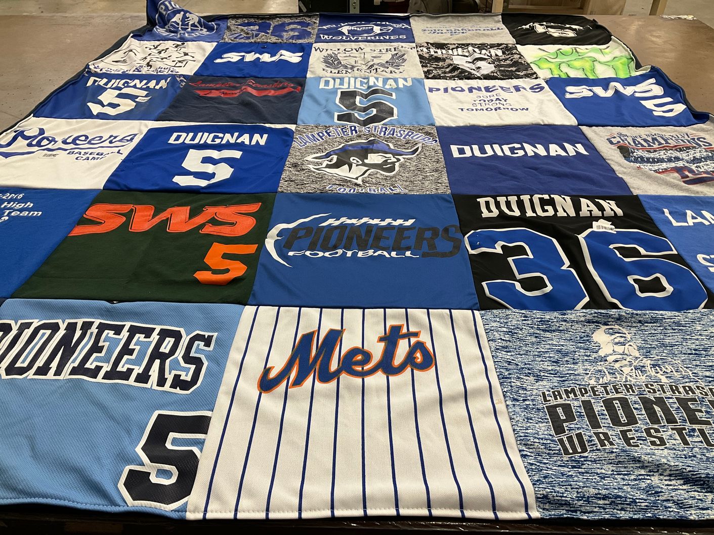 T-shirt quilt featuring lamplighter strasburg pioneers football team, lamplighter strasburg pioneers wrestling team by Teri from PA