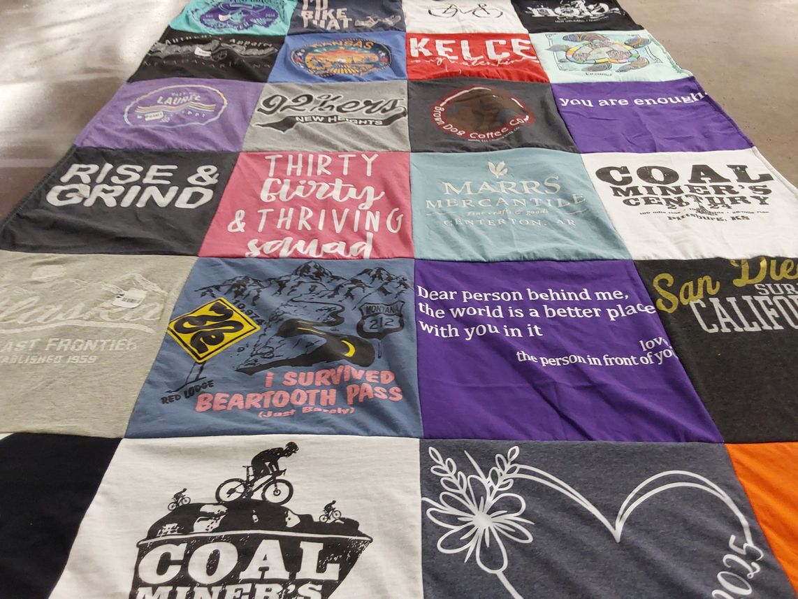 T-shirt quilt with hiking, traveling themes by Elaine from KS