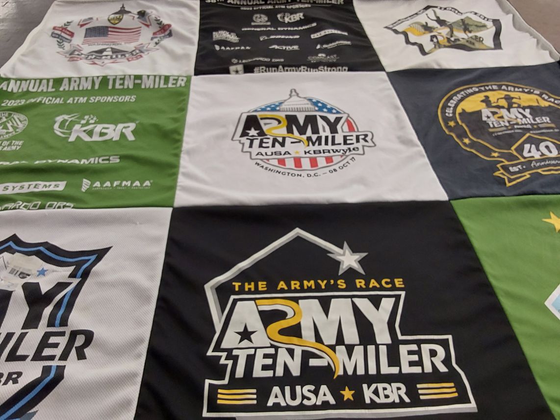T-shirt quilt with running, military events themes by Safiya from MD