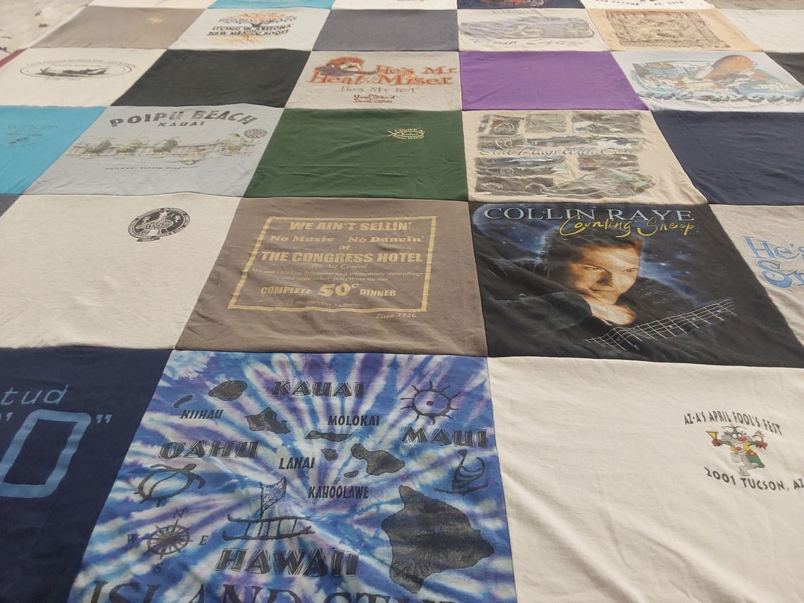 T-shirt quilt with travel, music themes by Cynthia from NV
