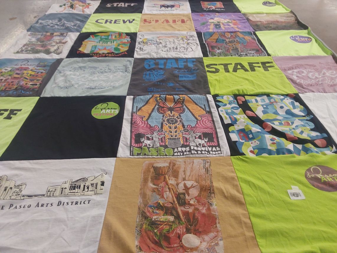 T-shirt quilt with arts, community themes by Anita from FL