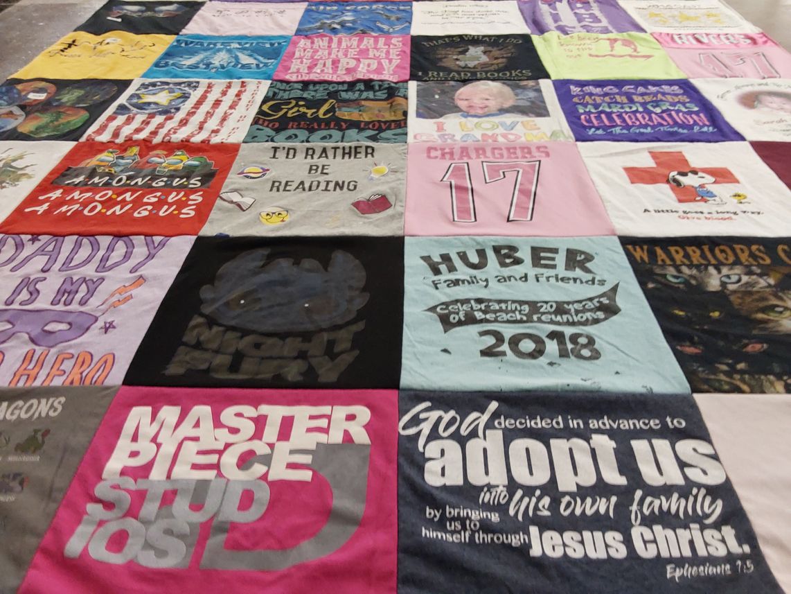T-shirt quilt with reading, family themes by Joy from NC