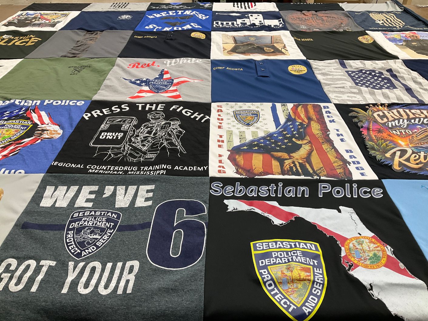 T-shirt quilt with law enforcement, community service themes by Danielle from FL