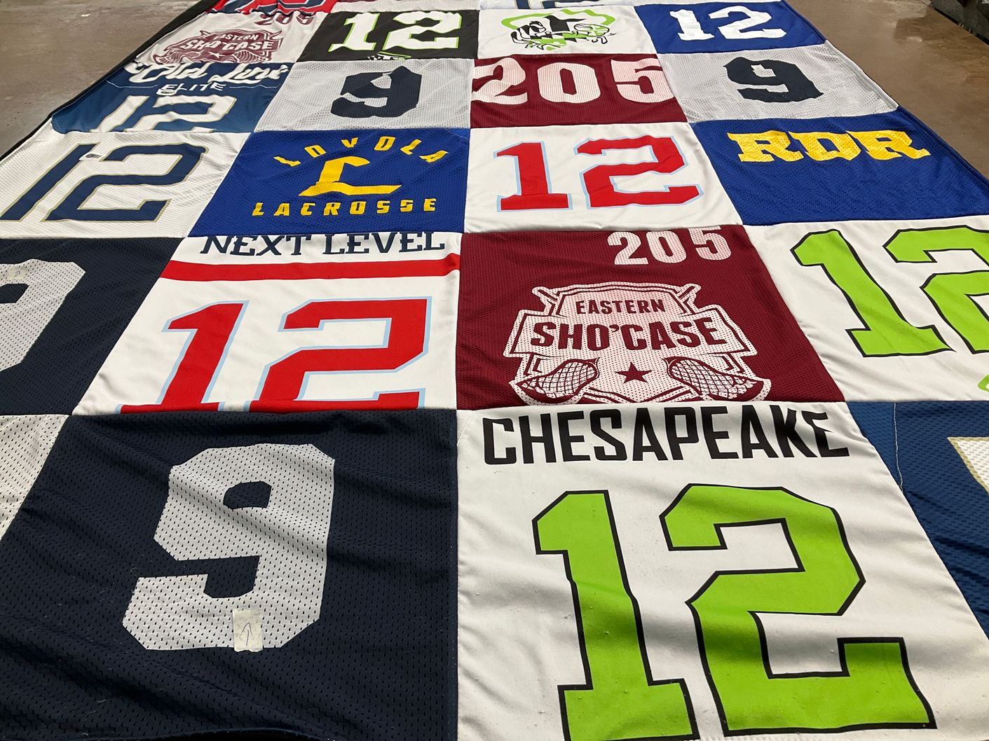 T-shirt quilt with lacrosse themes by Dericka from MD