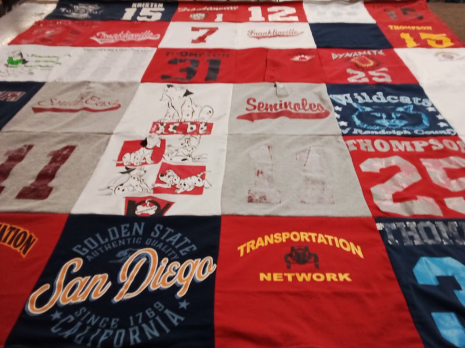 T-shirt quilt with sports, community themes by Donna from NC