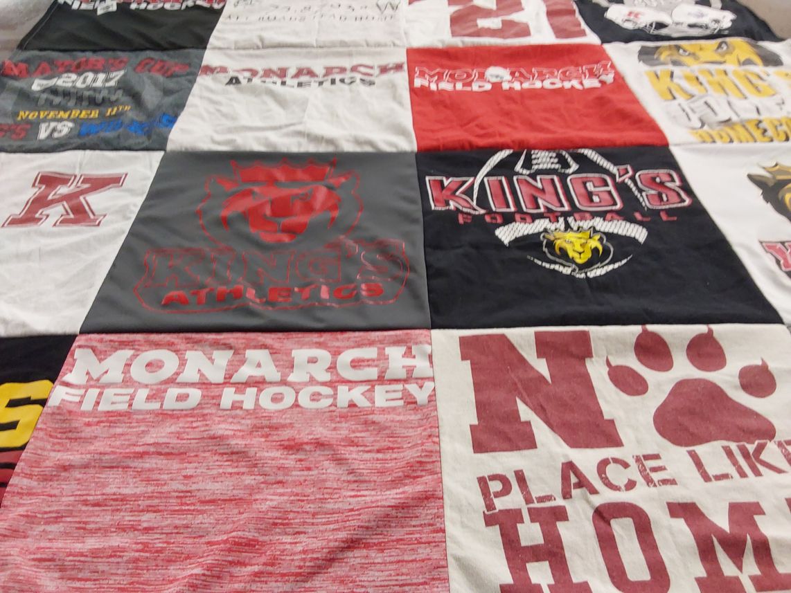 T-shirt quilt featuring monarch field hockey, king's college football by Brianne from PA