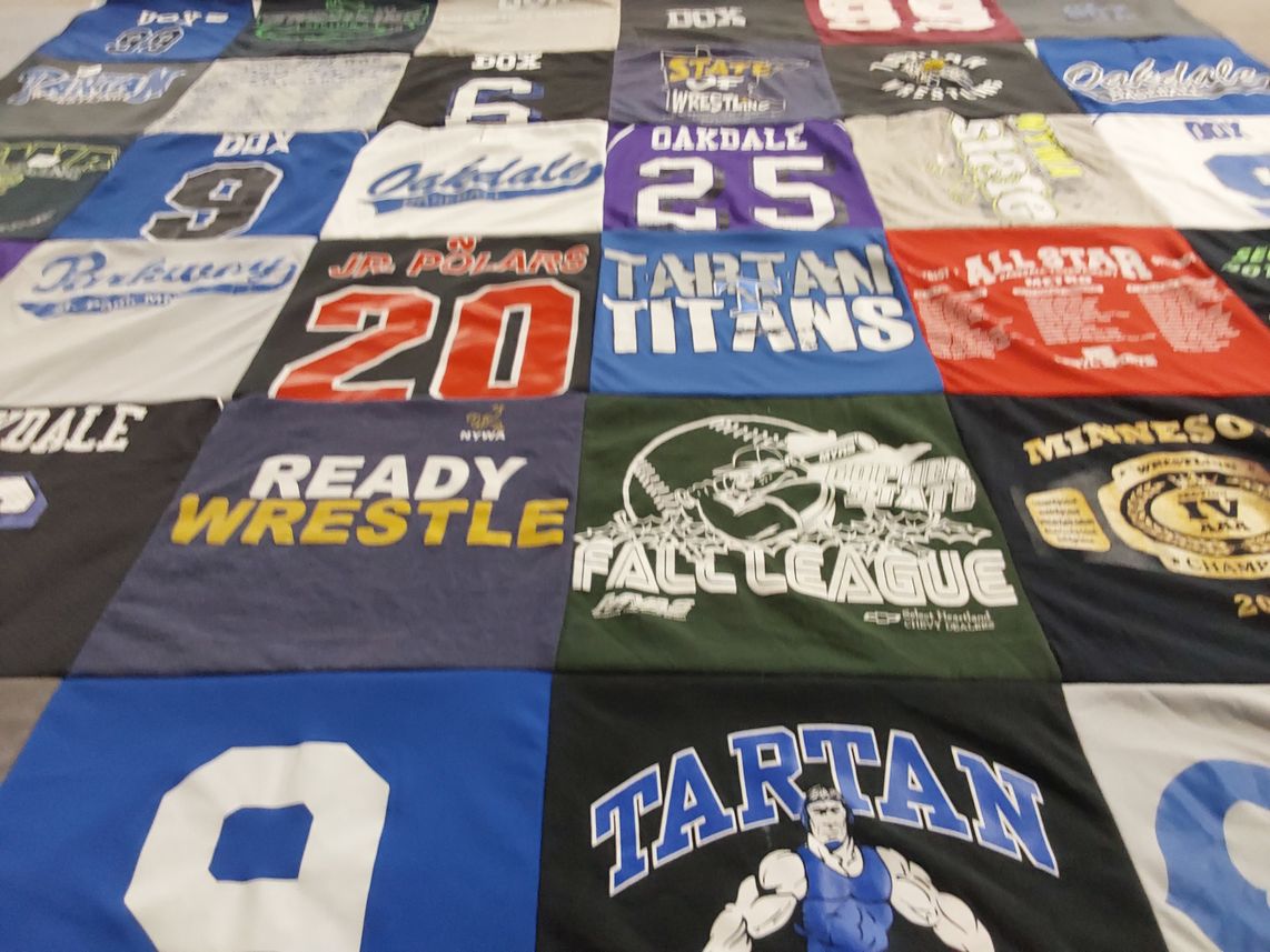 T-shirt quilt featuring tartan titans, oakdale polars by Angie from MN